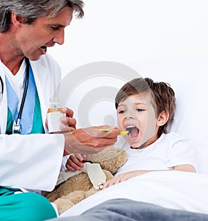 Child taking cough medicine