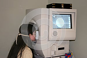 Child Taking the Field Of Vision Test photo