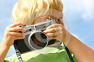 Child Taking Picture with Vintage Camera