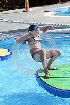 Child in tarzan pool