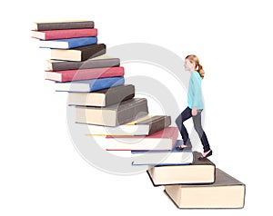 Child or teen climbing a stair case of books