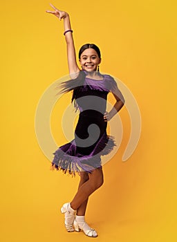 Child teen girl dancing rumba, samba cha-cha-cha. Ballroom dance school for teenager kids girl. Dress movement. Ballroom