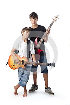 Child and teenager with guitar and bass