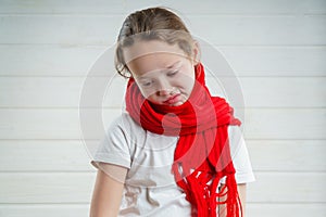 Child temperature. sore throat. bad condition. a child rooting. scarf