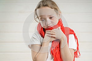 Child temperature. sore throat. bad condition. a child rooting. scarf