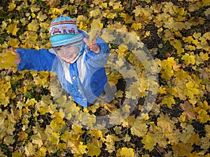 Child throw leaves