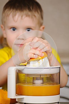 The child to wring out juice photo