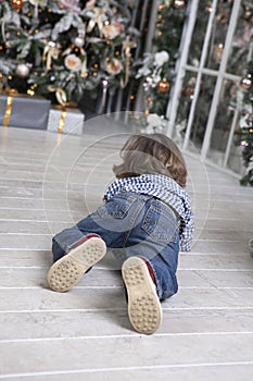 Child toddler crawling to gifts