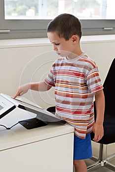 Child touching touch screen computer