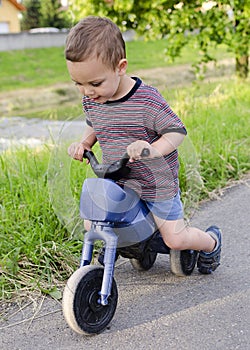 Child on toy bike