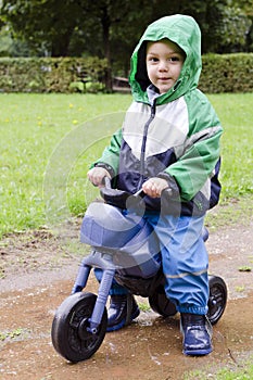 Child on toy bike