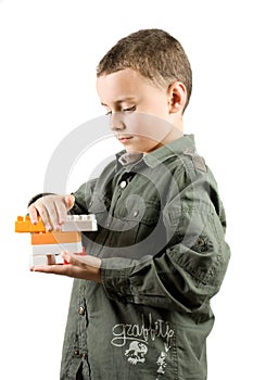 Child with toy building blocks