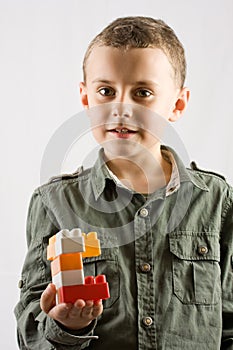 Child with toy building blocks