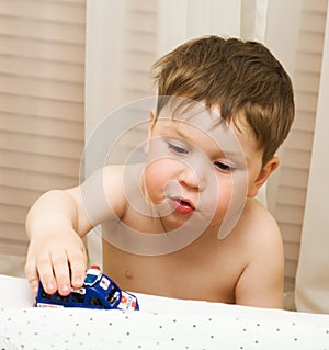 Child with toy car