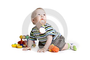 Child with a toy in the mouth