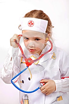 Child with toy phonendoscope photo