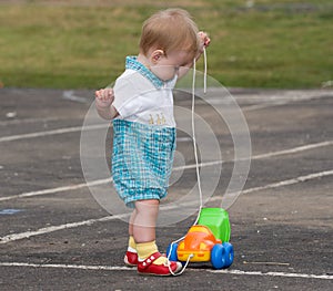 Child and toy truck