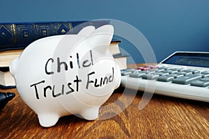 Child trust fund CTF written on a side of piggy bank photo