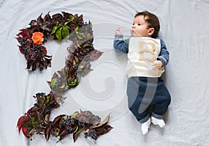 The child is two months old. 2 month old baby, 2 months birthday happy. Top view, flat lay