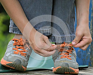 Boy Learning to Tie Shoelaces