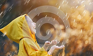 Child under autumn rain