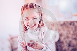 Child under school age laughing while reading funny history