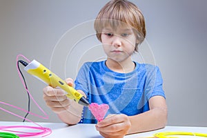 Child using 3D printing pen. Boy making heart. Creative, technology, leisure, education concept