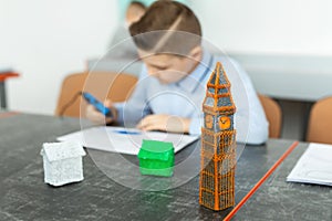 Child using 3D printing pen. Boy making new item. Creative, technology, leisure, education concept.