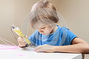 Child using 3D printing pen. Boy making new item. Creative, technology, leisure, education concept