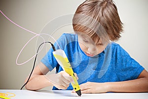 Child using 3D printing pen. Boy making new item. Creative, technology, leisure, education concept