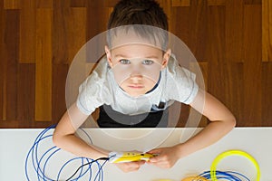 Child using 3D printing pen. Creative, technology, leisure, education concept