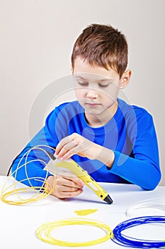 Child using 3d printing pen. Creative, technology, leisure, education concept