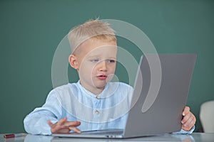 Child using gadgets to study. Computer education for kids. Little funny programmer. Genius child programming, computer