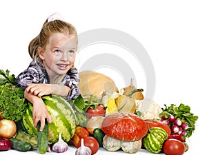 Child with vegetable on kitchen.