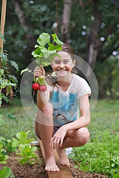 Child in veggie patch photo