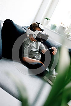 Child in virtual augmented reality helmet