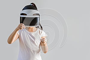 Child with Virtual Reality, VR, Headset Studio Shot Isolated on White Background. Kid Exploring Digital Virtual World with VR