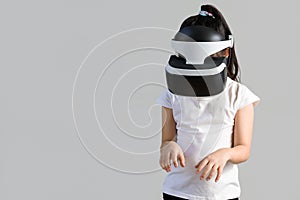 Child with Virtual Reality, VR, Headset Studio Shot Isolated on White Background. Kid Exploring Digital Virtual World with VR