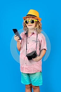 Child vlogger making video call, chatting. Kid tourist blogger making photo for social networks on phone. Travel with