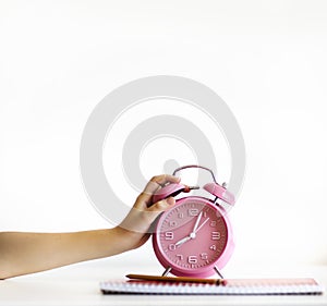 Child waking up from sleep turning off clock