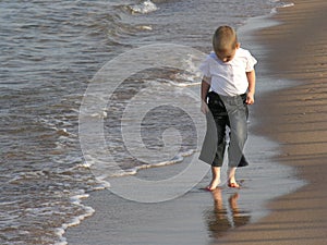 Child walk on beach
