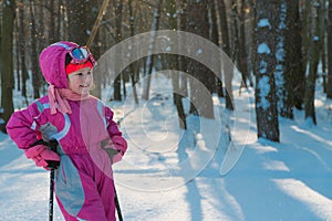 Child. a walk in the forest in winter snow child