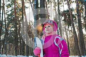 Child. a walk in the forest in winter snow child