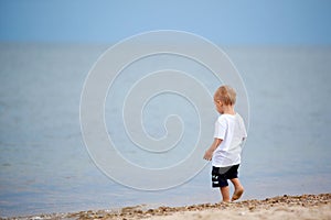 Child walking on the beach