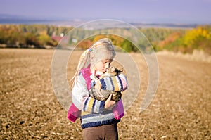 Child walking with his cute cat alone