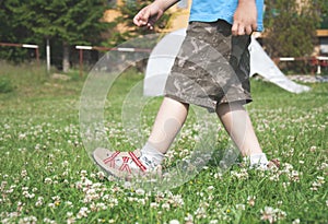 Child walking on the meadow