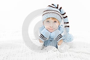 Child in warm winter hat and mittens