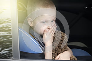 The child was rocked in a car seat. The boy suffers from kinetosis and motion sickness. The concept of motion sickness and