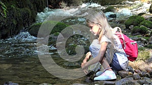 Child Washing Hands in Mountain River, Kid at Camp, Girl Playing Outdoor Brook