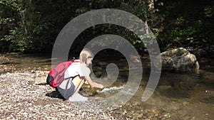 Child Washing Hands in River Water, Kid Hiking at Camping in Mountains Trails, Teenager Girl Walking in Forest, Adventure Trip